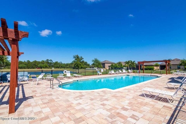 980 Dillard Dr SE, Palm Bay, FL 32909 - community pool with a patio and a pergola