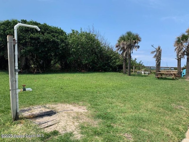 112 Carmen St, Melbourne Beach, FL 32951 - view of green lawn