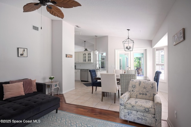 112 Carmen St, Melbourne Beach, FL 32951 - dining area with light wood-style floors, ceiling fan, and high vaulted ceiling