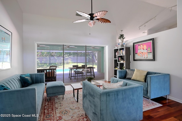 112 Carmen St, Melbourne Beach, FL 32951 - living area with ceiling fan, track lighting, wood finished floors, and high vaulted ceiling