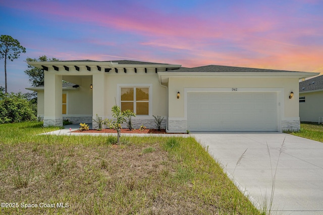 942 Toluca St SE Unit 1, Palm Bay, FL 32909 - view of front of house with stone siding, an attached garage, concrete driveway, and stucco siding