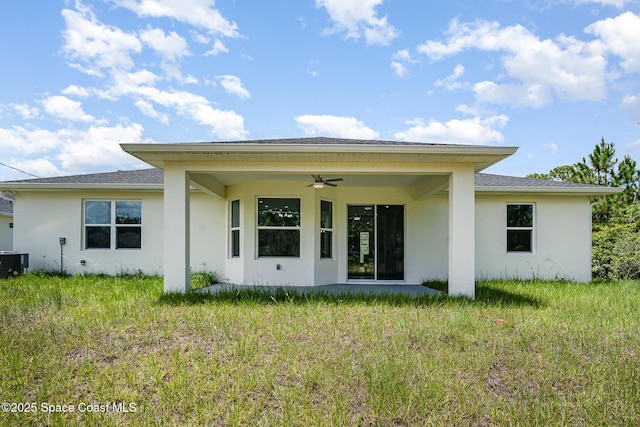 942 Toluca St SE Unit 1, Palm Bay, FL 32909 - back of house with ceiling fan and stucco siding