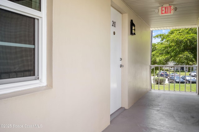 61 Woodland Dr Unit 201, Vero Beach, FL 32962 - property entrance featuring stucco siding