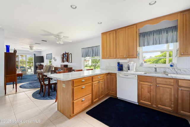61 Woodland Dr Unit 201, Vero Beach, FL 32962 - kitchen featuring white dishwasher, a peninsula, light countertops, and recessed lighting