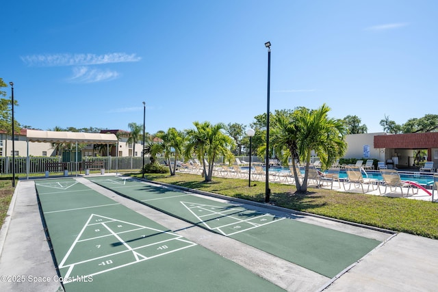 61 Woodland Dr Unit 201, Vero Beach, FL 32962 - surrounding community with a pool and shuffleboard