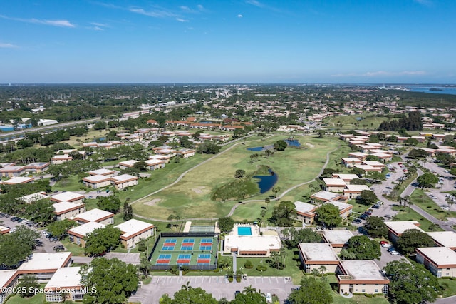 61 Woodland Dr Unit 201, Vero Beach, FL 32962 - aerial overview of property's location featuring a large body of water, a golf course, and nearby suburban area