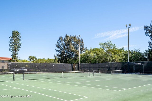 61 Woodland Dr Unit 201, Vero Beach, FL 32962 - view of tennis court with community basketball court