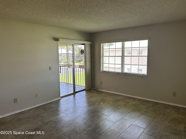 951 Sonesta Ave NE Unit 204, Palm Bay, FL 32905 - empty room featuring a textured ceiling and baseboards