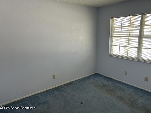 951 Sonesta Ave NE Unit 204, Palm Bay, FL 32905 - carpeted empty room with baseboards