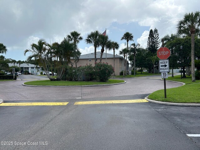 951 Sonesta Ave NE Unit 204, Palm Bay, FL 32905 - view of street featuring traffic signs and curbs