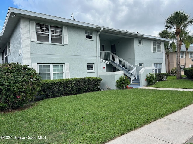 951 Sonesta Ave NE Unit 204, Palm Bay, FL 32905 - view of building exterior featuring stairway
