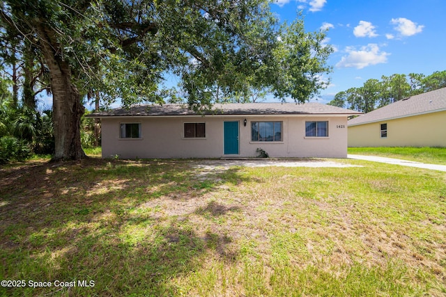 1421 Degroodt Rd SW, Palm Bay, FL 32908 - view of front of property with stucco siding and a front lawn