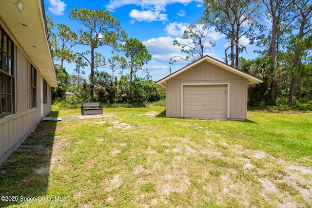 1421 Degroodt Rd SW, Palm Bay, FL 32908 - view of grassy yard featuring a detached garage and an outdoor structure