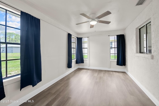 1421 Degroodt Rd SW, Palm Bay, FL 32908 - empty room featuring wood finished floors and ceiling fan