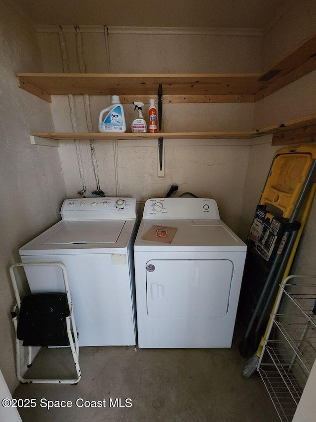 5807 N Atlantic Ave Unit 322, Cape Canaveral, FL 32920 - laundry area featuring washer and dryer