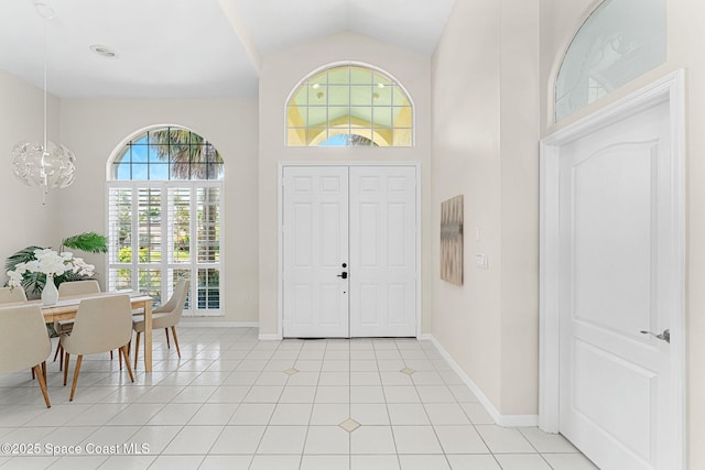 174 Martesia Way, Indian Harbour Beach, FL 32937 - entrance foyer featuring light tile patterned floors and high vaulted ceiling