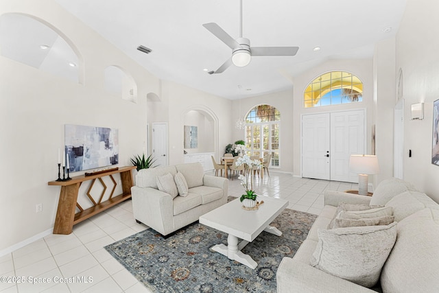 174 Martesia Way, Indian Harbour Beach, FL 32937 - living area with light tile patterned floors, high vaulted ceiling, a ceiling fan, arched walkways, and recessed lighting
