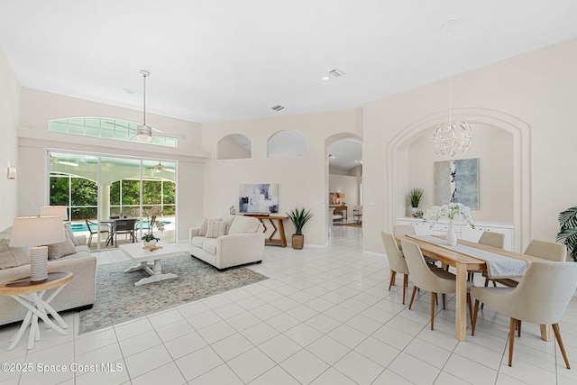 174 Martesia Way, Indian Harbour Beach, FL 32937 - living area with arched walkways, a chandelier, and light tile patterned floors
