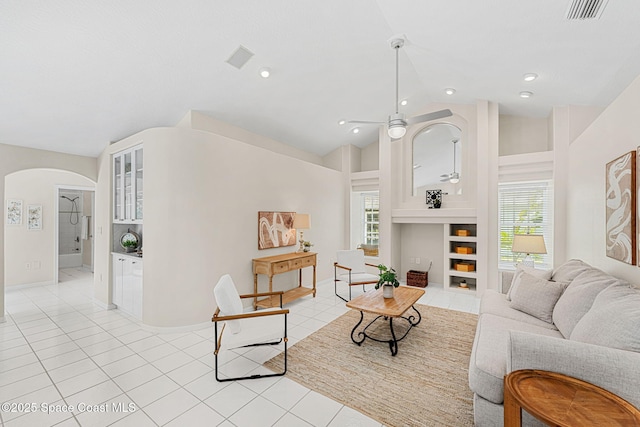 174 Martesia Way, Indian Harbour Beach, FL 32937 - living room with arched walkways, lofted ceiling, light tile patterned floors, and ceiling fan