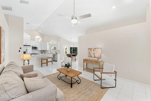 174 Martesia Way, Indian Harbour Beach, FL 32937 - living area with lofted ceiling, light tile patterned flooring, and ceiling fan