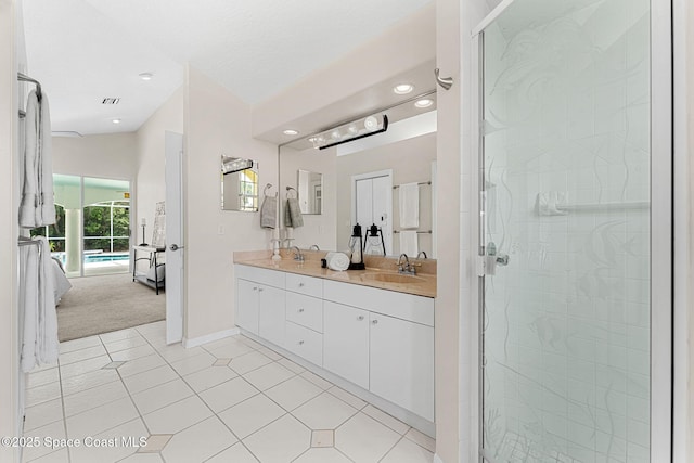 174 Martesia Way, Indian Harbour Beach, FL 32937 - bathroom featuring ensuite bath, double vanity, a shower stall, tile patterned flooring, and recessed lighting