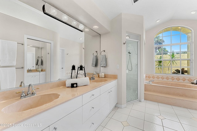 174 Martesia Way, Indian Harbour Beach, FL 32937 - full bath featuring double vanity, a bath, a stall shower, tile patterned flooring, and lofted ceiling