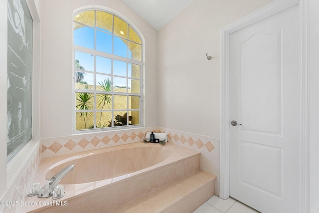 174 Martesia Way, Indian Harbour Beach, FL 32937 - full bath featuring vaulted ceiling, a bath, and tile patterned flooring