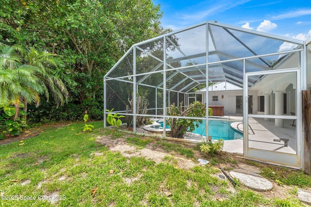174 Martesia Way, Indian Harbour Beach, FL 32937 - swimming pool featuring a patio area, a lawn, and glass enclosure