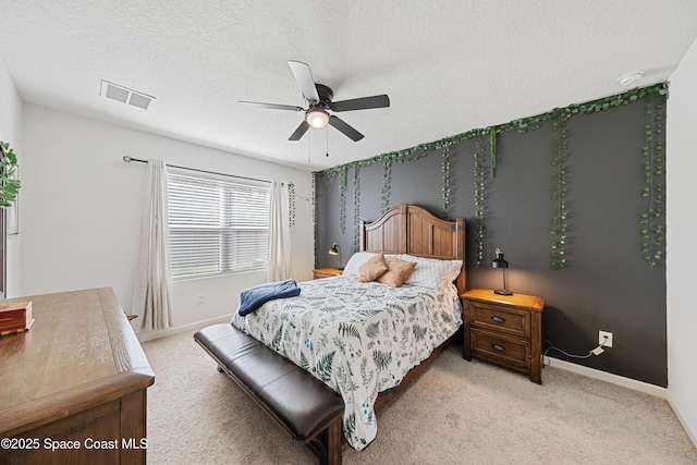 5071 Talbot Blvd, Cocoa, FL 32926 - bedroom with light colored carpet, ceiling fan, and a textured ceiling
