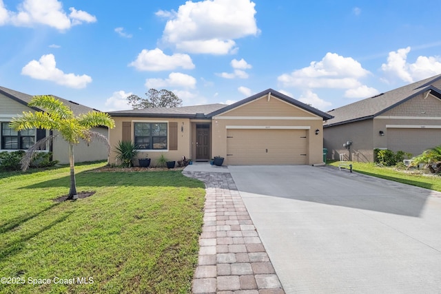 5071 Talbot Blvd, Cocoa, FL 32926 - ranch-style home with a garage, driveway, a front lawn, and stucco siding