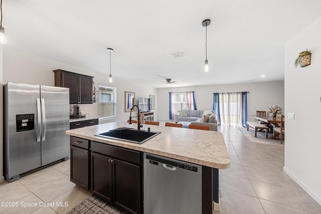 5071 Talbot Blvd, Cocoa, FL 32926 - kitchen featuring stainless steel appliances, light countertops, and light tile patterned floors