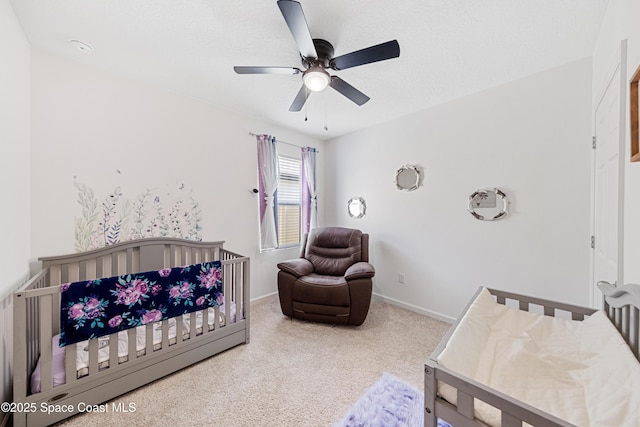 5071 Talbot Blvd, Cocoa, FL 32926 - bedroom with carpet flooring, a crib, and ceiling fan