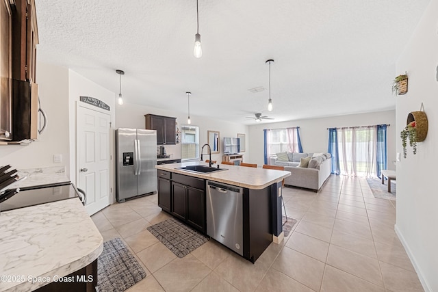 5071 Talbot Blvd, Cocoa, FL 32926 - kitchen featuring stainless steel appliances, light countertops, hanging light fixtures, and a ceiling fan