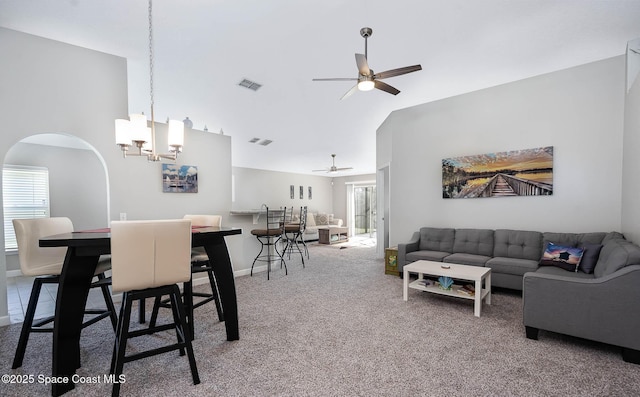 2221 Spring Creek Cir, Palm Bay, FL 32905 - carpeted living area with ceiling fan, arched walkways, high vaulted ceiling, and a chandelier