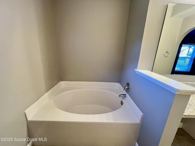 2221 Spring Creek Cir, Palm Bay, FL 32905 - bathroom featuring a garden tub