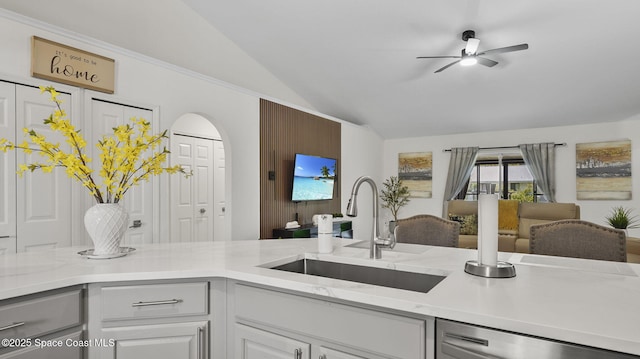 160 Eureka Ave NE, Palm Bay, FL 32907 - kitchen featuring dishwasher, lofted ceiling, ceiling fan, open floor plan, and arched walkways