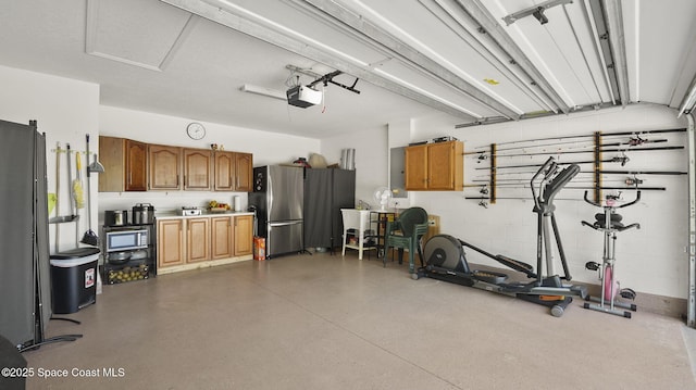 160 Eureka Ave NE, Palm Bay, FL 32907 - garage featuring freestanding refrigerator, a garage door opener, and electric panel