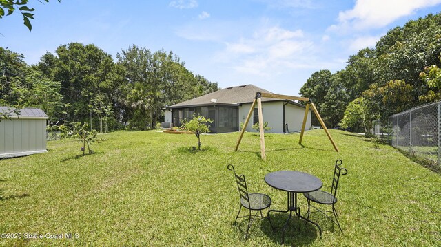160 Eureka Ave NE, Palm Bay, FL 32907 - view of yard with a sunroom