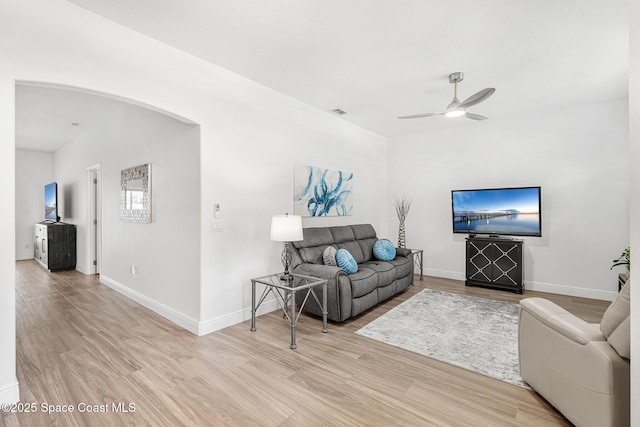 1014 Pelican Ln, Rockledge, FL 32955 - living area featuring a ceiling fan, wood finished floors, and arched walkways