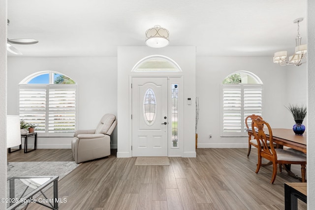 1014 Pelican Ln, Rockledge, FL 32955 - foyer with a chandelier and light wood finished floors