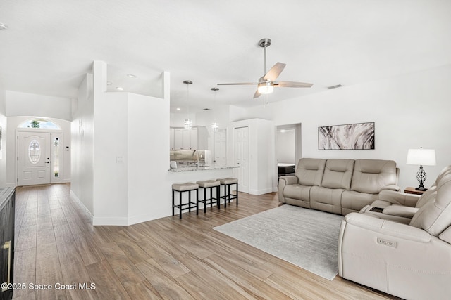 1014 Pelican Ln, Rockledge, FL 32955 - living room with ceiling fan, light wood-style flooring, and recessed lighting