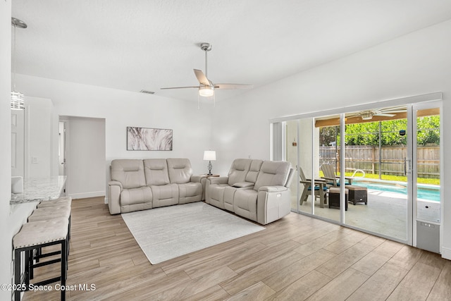 1014 Pelican Ln, Rockledge, FL 32955 - living area with ceiling fan and light wood-style flooring