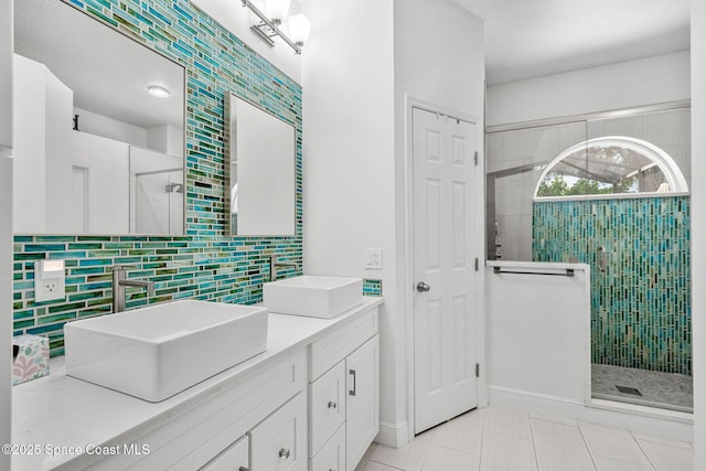 1014 Pelican Ln, Rockledge, FL 32955 - full bath featuring double vanity, a stall shower, decorative backsplash, and tile patterned floors
