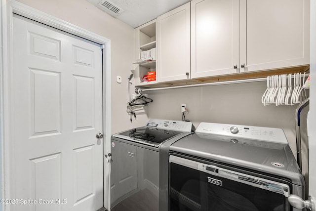1014 Pelican Ln, Rockledge, FL 32955 - laundry area with independent washer and dryer and cabinet space