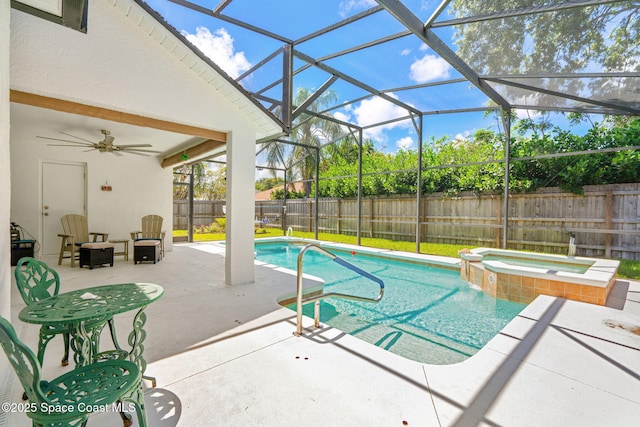 1014 Pelican Ln, Rockledge, FL 32955 - view of pool featuring a patio area, a fenced backyard, ceiling fan, a lanai, and a pool with connected hot tub