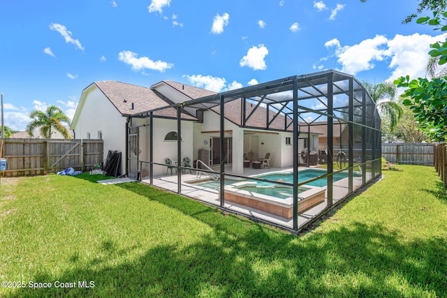 1014 Pelican Ln, Rockledge, FL 32955 - back of house featuring stucco siding, a patio area, a fenced backyard, a pool with connected hot tub, and roof with shingles