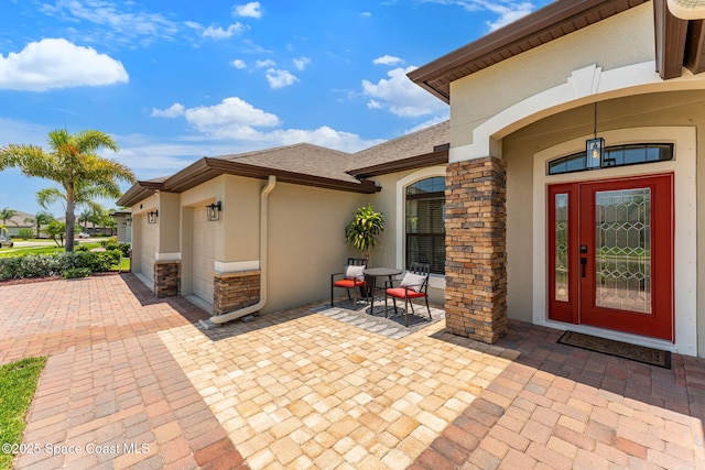 3550 Salt Marsh Cir, West Melbourne, FL 32904 - entrance to property with stucco siding, stone siding, and a patio area