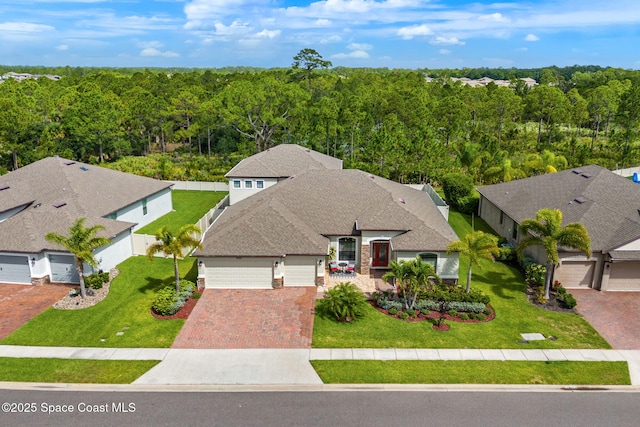 3550 Salt Marsh Cir, West Melbourne, FL 32904 - view of subject property with a heavily wooded area