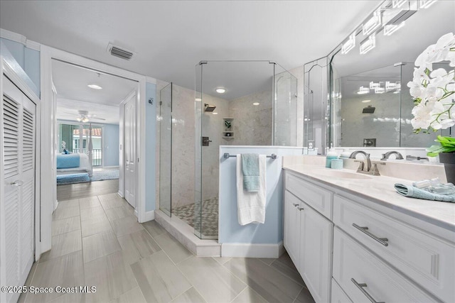 8954 Puerto Del Rio Dr Unit 1503, Cape Canaveral, FL 32920 - full bathroom featuring a shower stall, vanity, connected bathroom, and ceiling fan