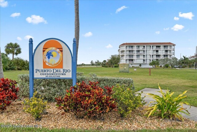 8954 Puerto Del Rio Dr Unit 1503, Cape Canaveral, FL 32920 - view of home's community featuring a lawn